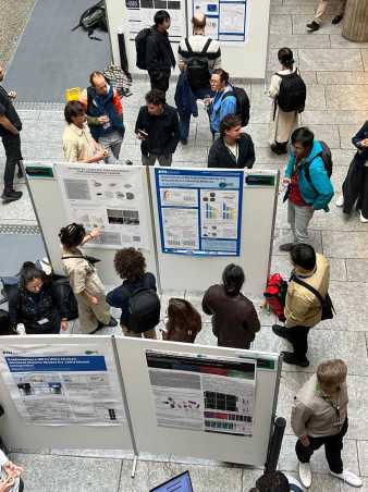 Poster exhibition with people looking at posters